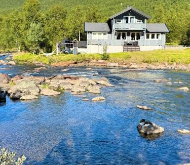 Narvik House | Riverfront house with 98 inch TV, ps5 & activities