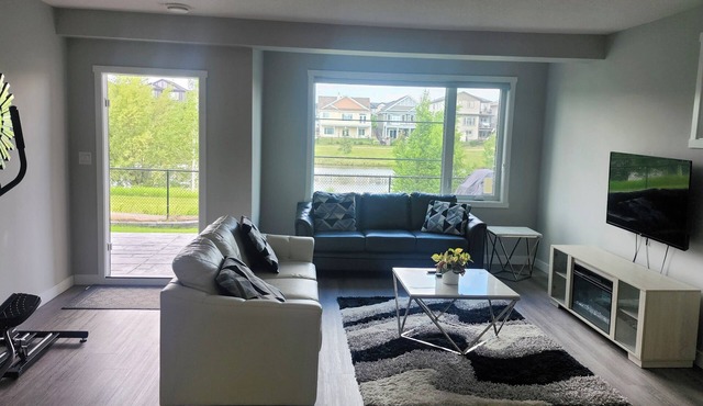 Charming 2-bedroom pond backing walk out suite with view of the lake in Beaumont